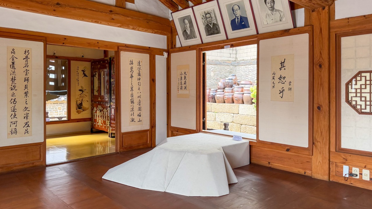 The pond, moved into the hall · The small pond from the yard, flipped and set on the floor of the main hall. ⓒBRIQUE MAGAZINE