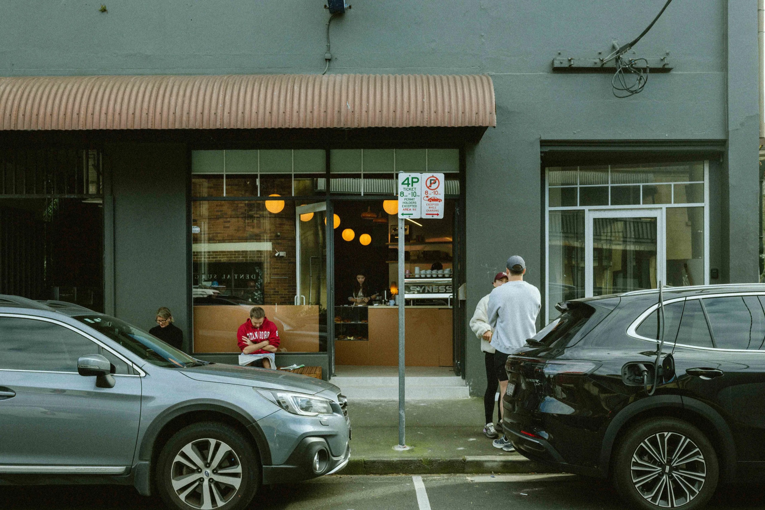 Where the doughnut shop was · 13 Beattie Street. The frontage is a single bay of glass, with round pendants lit in a row deeper inside. ©Yusuke Oba · Broadsheet