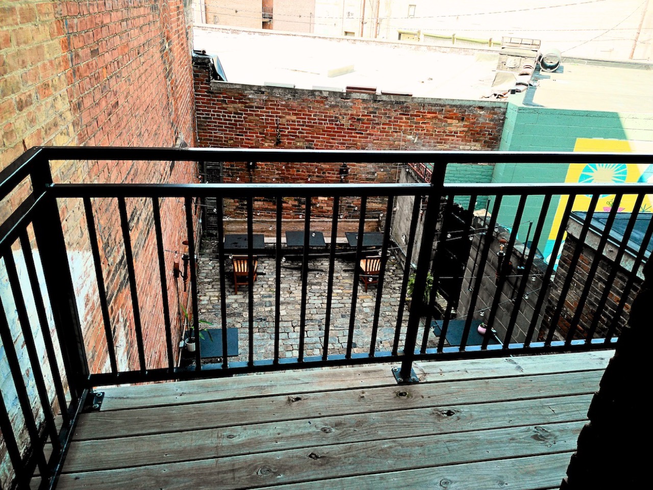 Where the evenings happen · The plaster was never patched, and the brick stayed exposed. ©Radical Bean Cooperative
