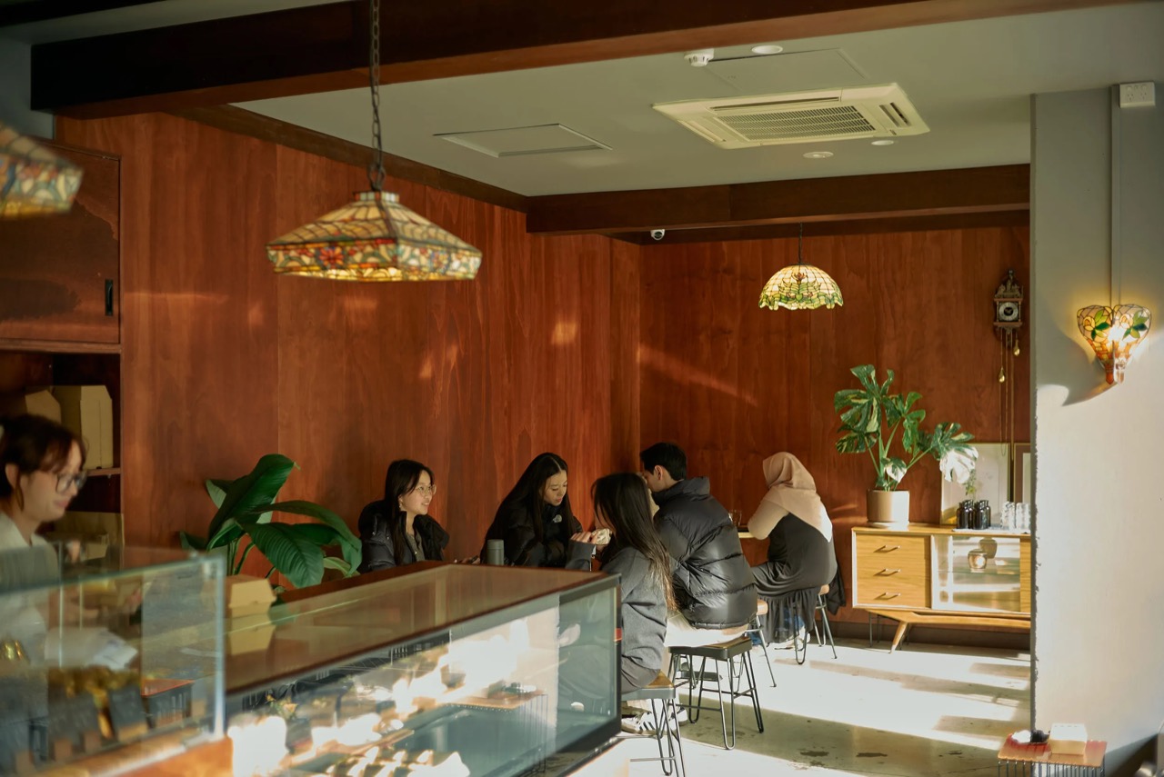 Timber and stained glass · The lamps and furniture are vintage finds collected by co-owner Roy Park. ⓒBroadsheet