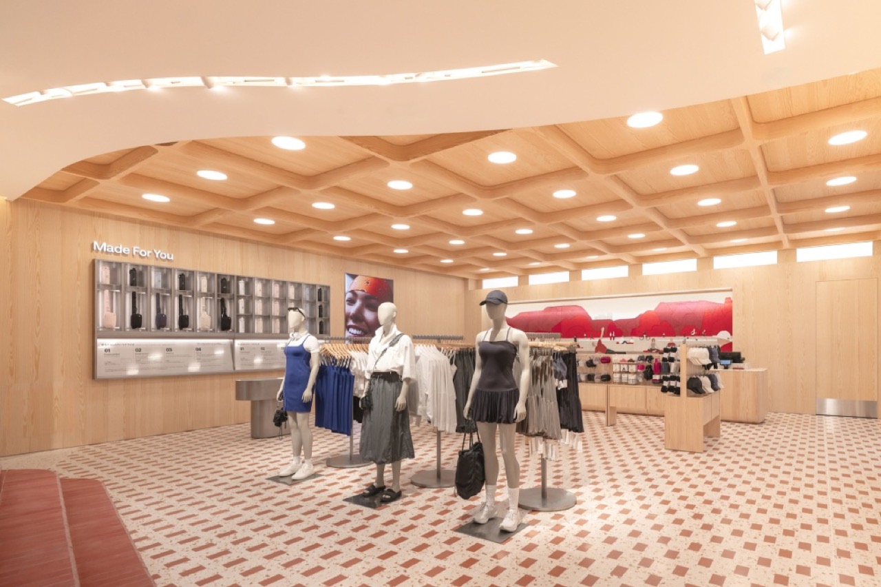 Numbered so you can choose · The 'Made For You' wall. Engraving samples hang on the left, numbered from 01. ⓒlululemon