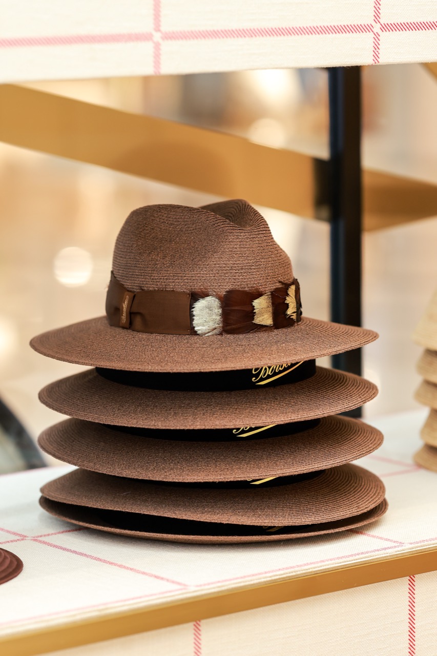 Seven weeks in one object · A Panama-type hat. The ribbon and feather trim are attached by hand too. ⓒBorsalino