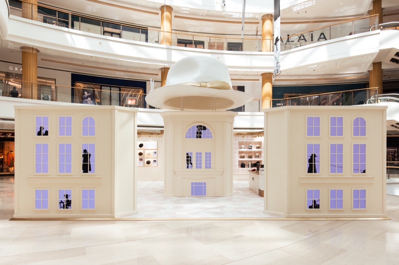 A hat where the roof goes · The pavilion front. Display tables and a cash desk are visible through the windows. ⓒBorsalino