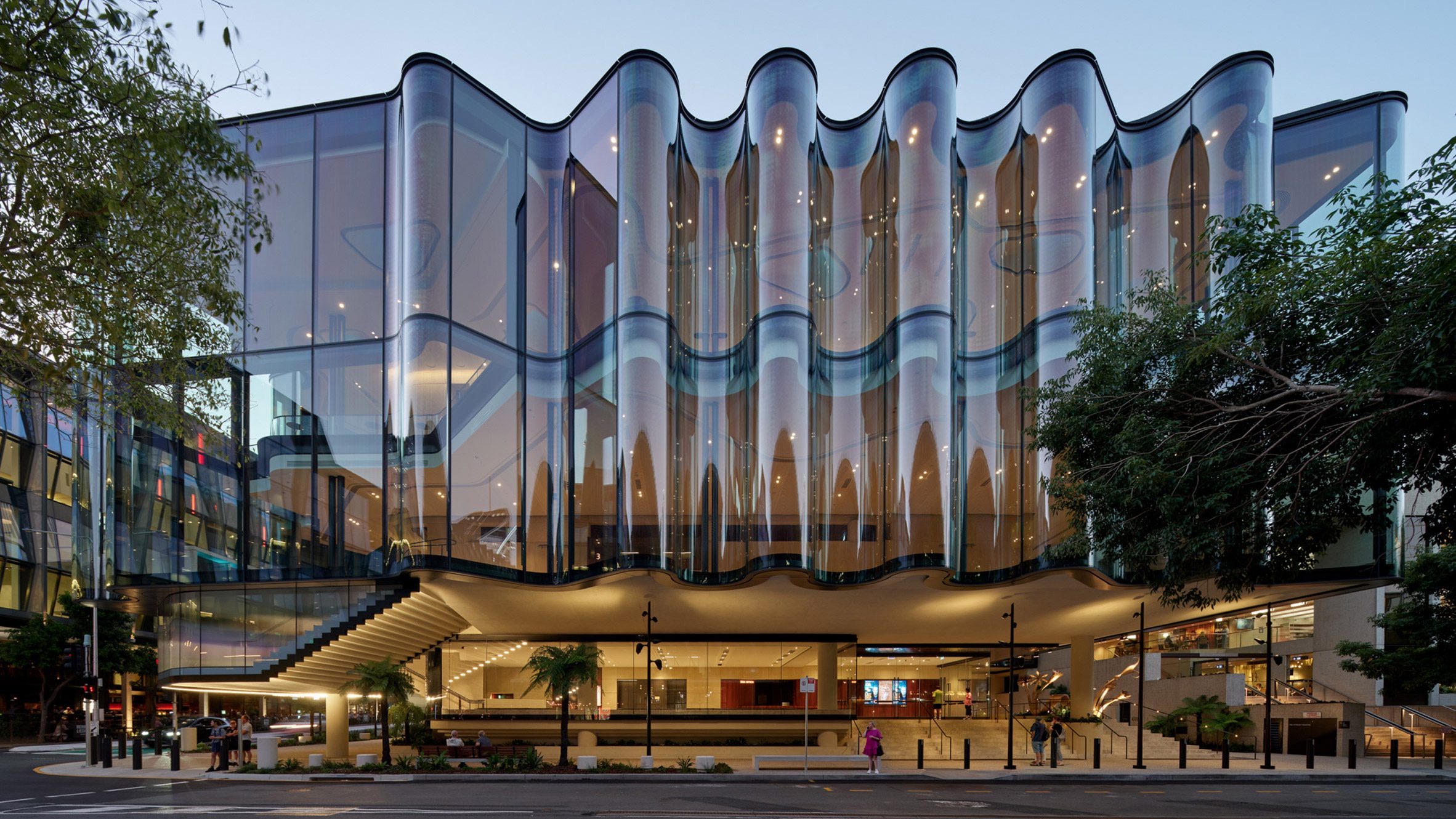 The rippling glass front · The ground-floor foyer sits beneath the glass volume that pushes out over the street from the first floor. ⓒChristopher Frederick Jones · via Dezeen